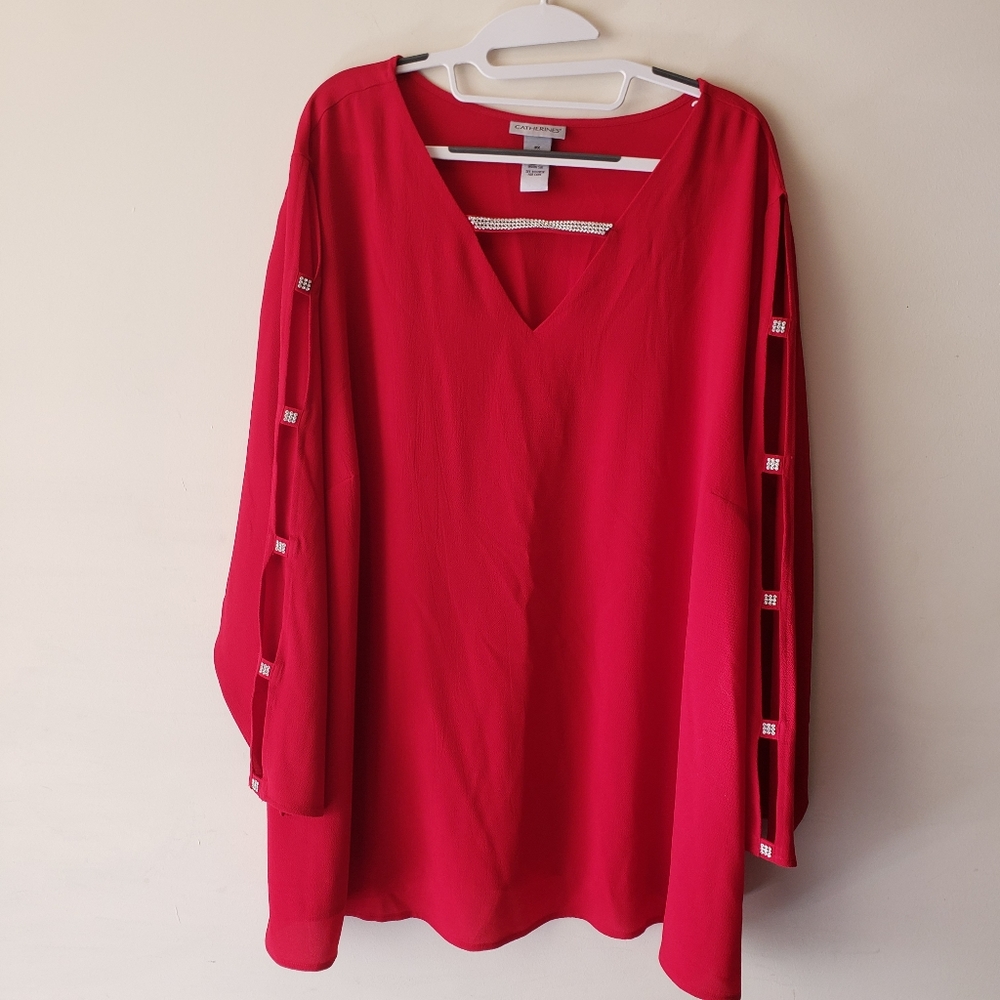 Womens red blouse with pearl caged sleeves